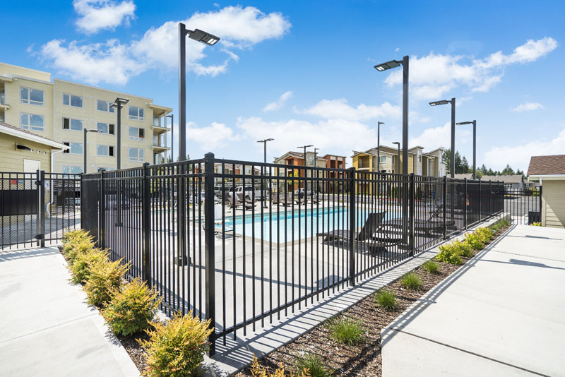 Black wrought iron security fence installed at apartment complex in Lacey, WA by Summit Fence Co. LLC
