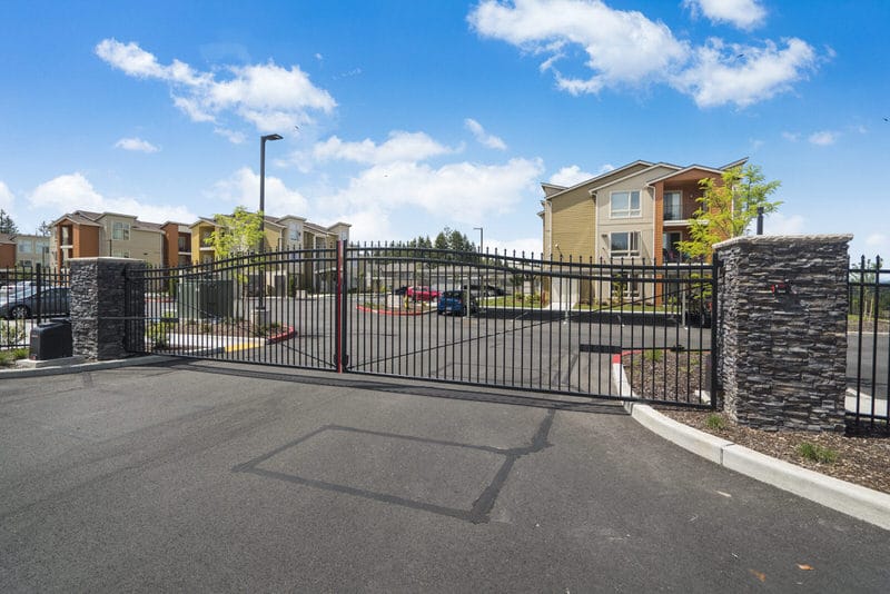 Black wrought iron security fence installed at apartment complex in Lacey, WA by Summit Fence Co. LLC