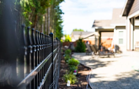 Black ornamental iron residential fencing in Olympia, WA installed by Summit Fence Co. LLC