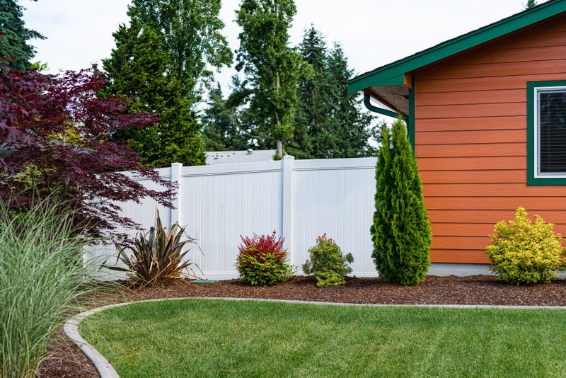Residential vinyl fence in Olympia, WA installed by Summit Fence Co. LLC